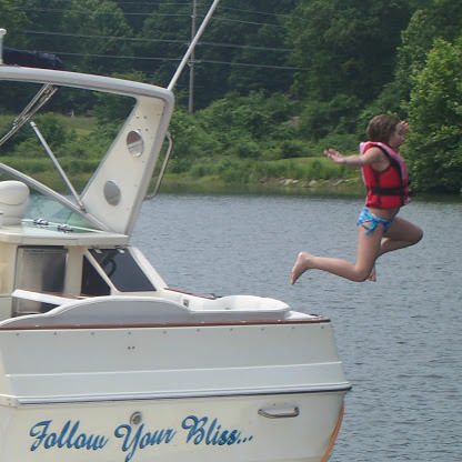 Our boat and daughter Holli.